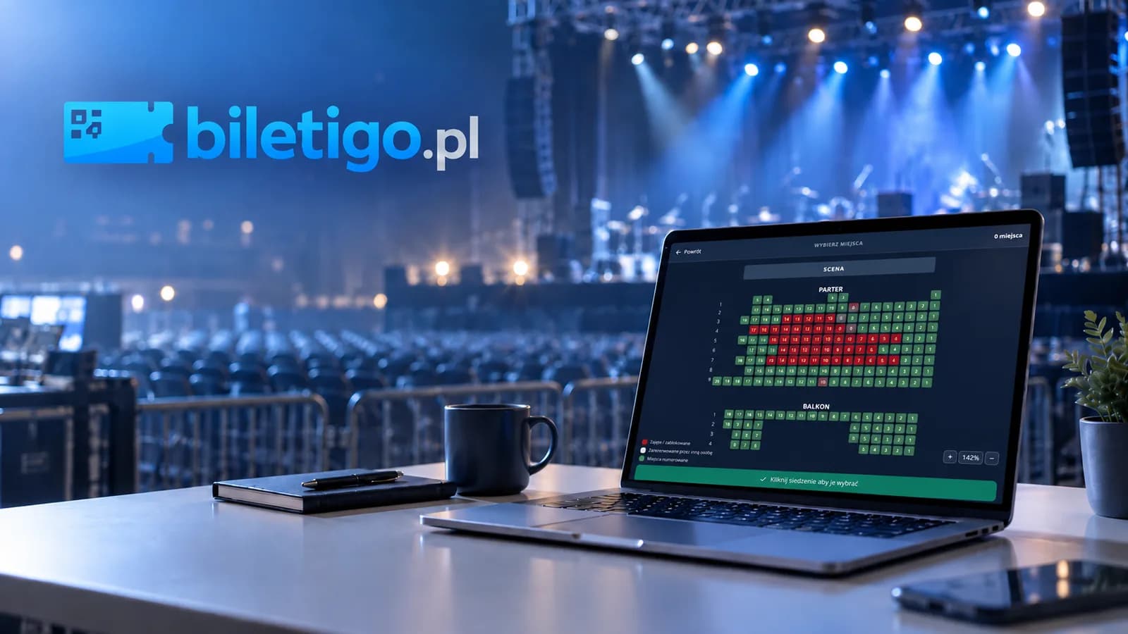 Laptop z panelem sprzedaży biletów na tle sali koncertowej